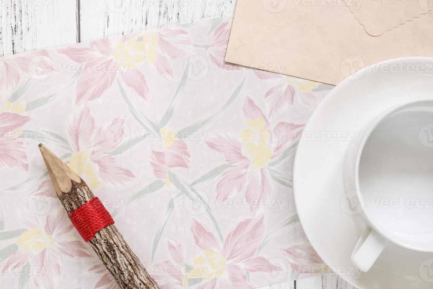 Floral paper with a pencil and coffee photo