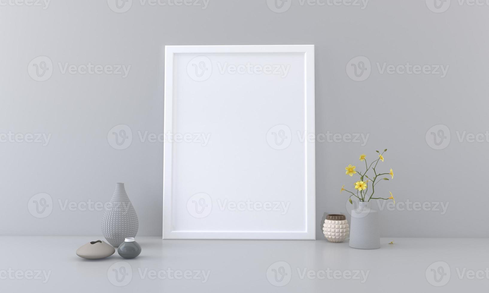 A blank picture frame and vases on a table photo