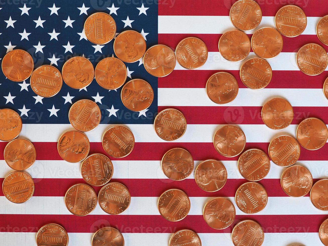 Dollar coins and flag of the United States photo