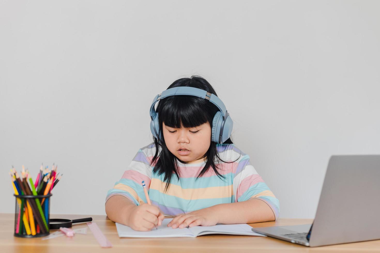 girls studying online at home photo