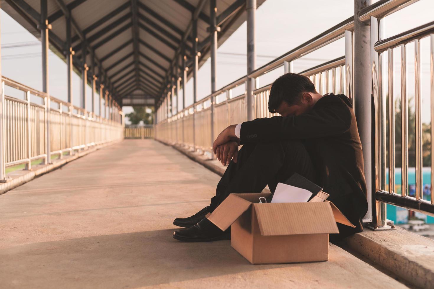 Sad Asian businessman losing job photo