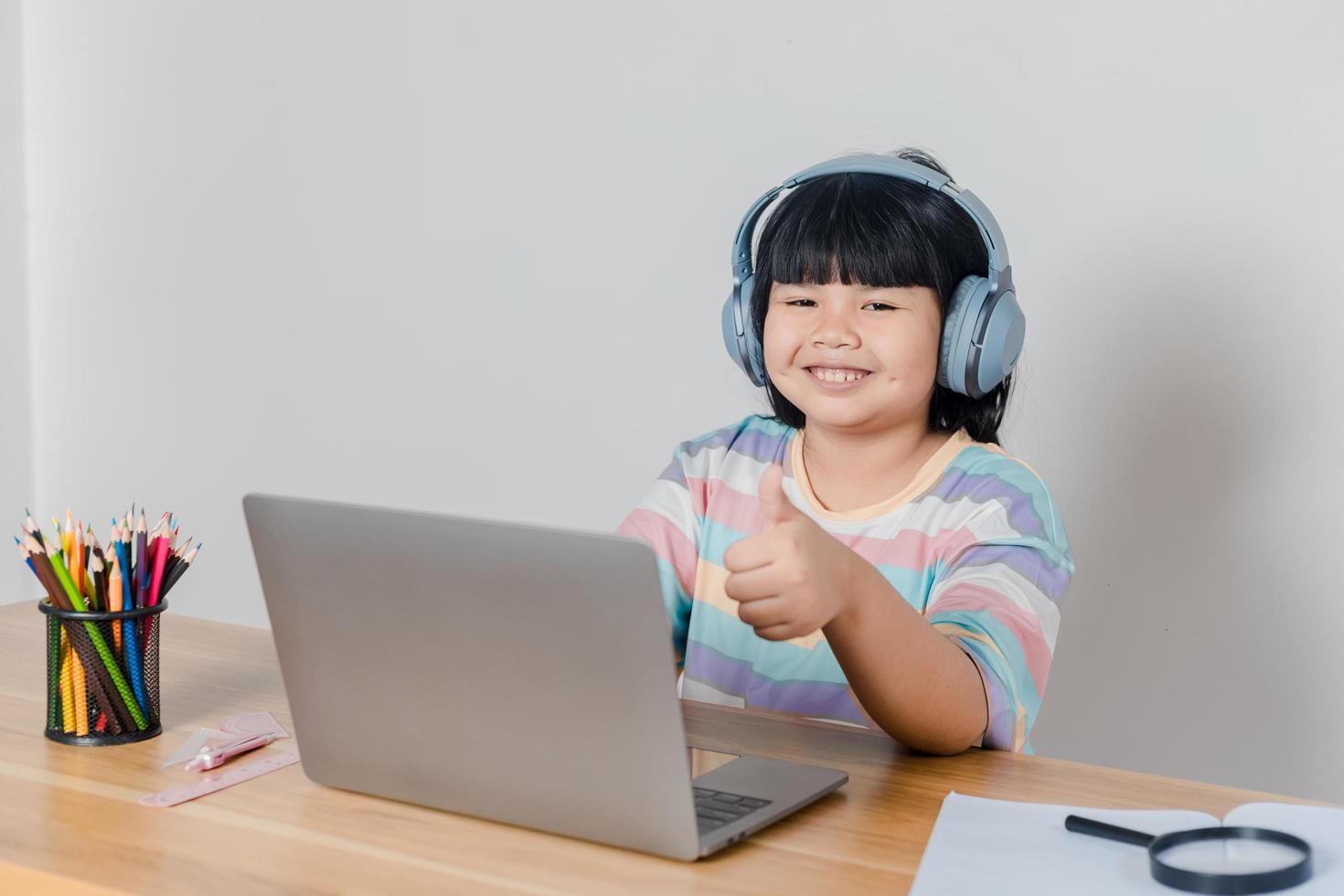 girls studying online at home photo