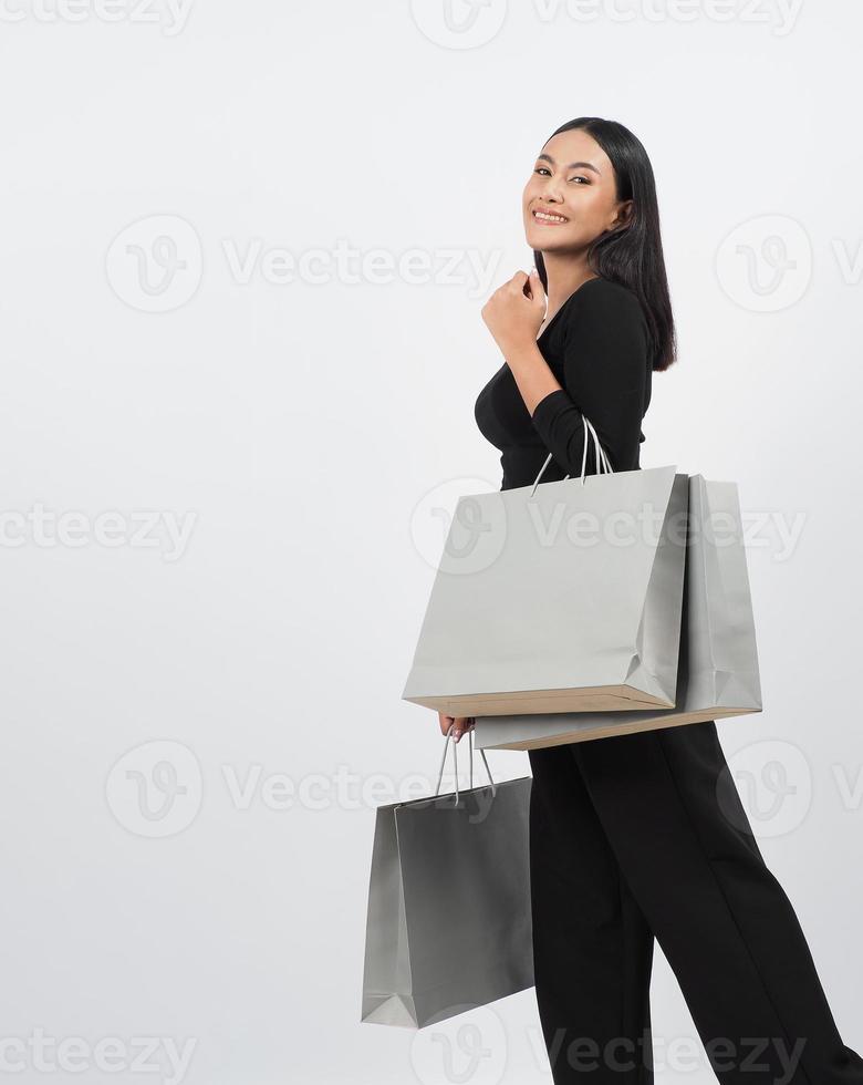 Woman shopping concept. Happily girl and shopping bags photo