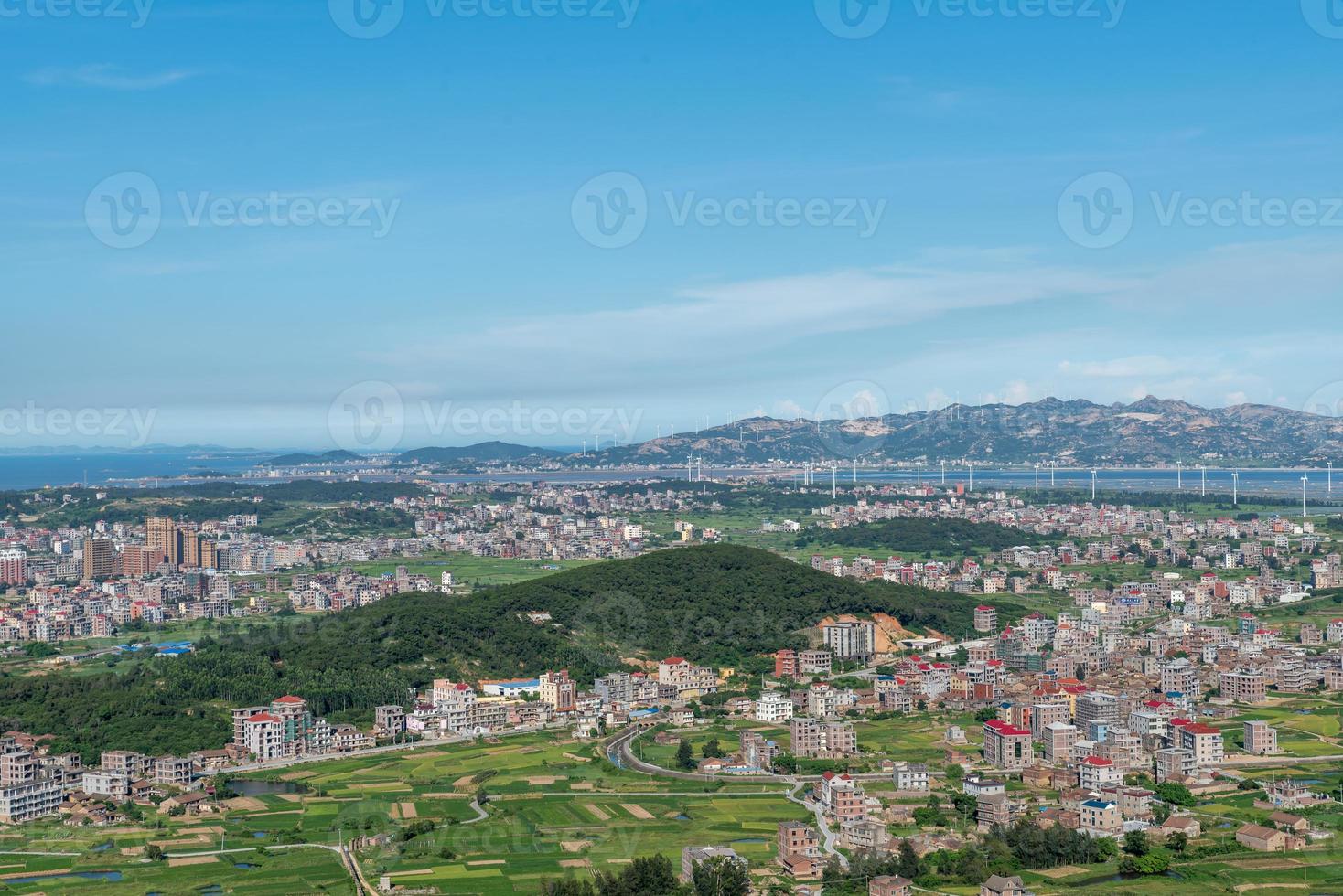 The mountain overlooks the rich villages and towns photo