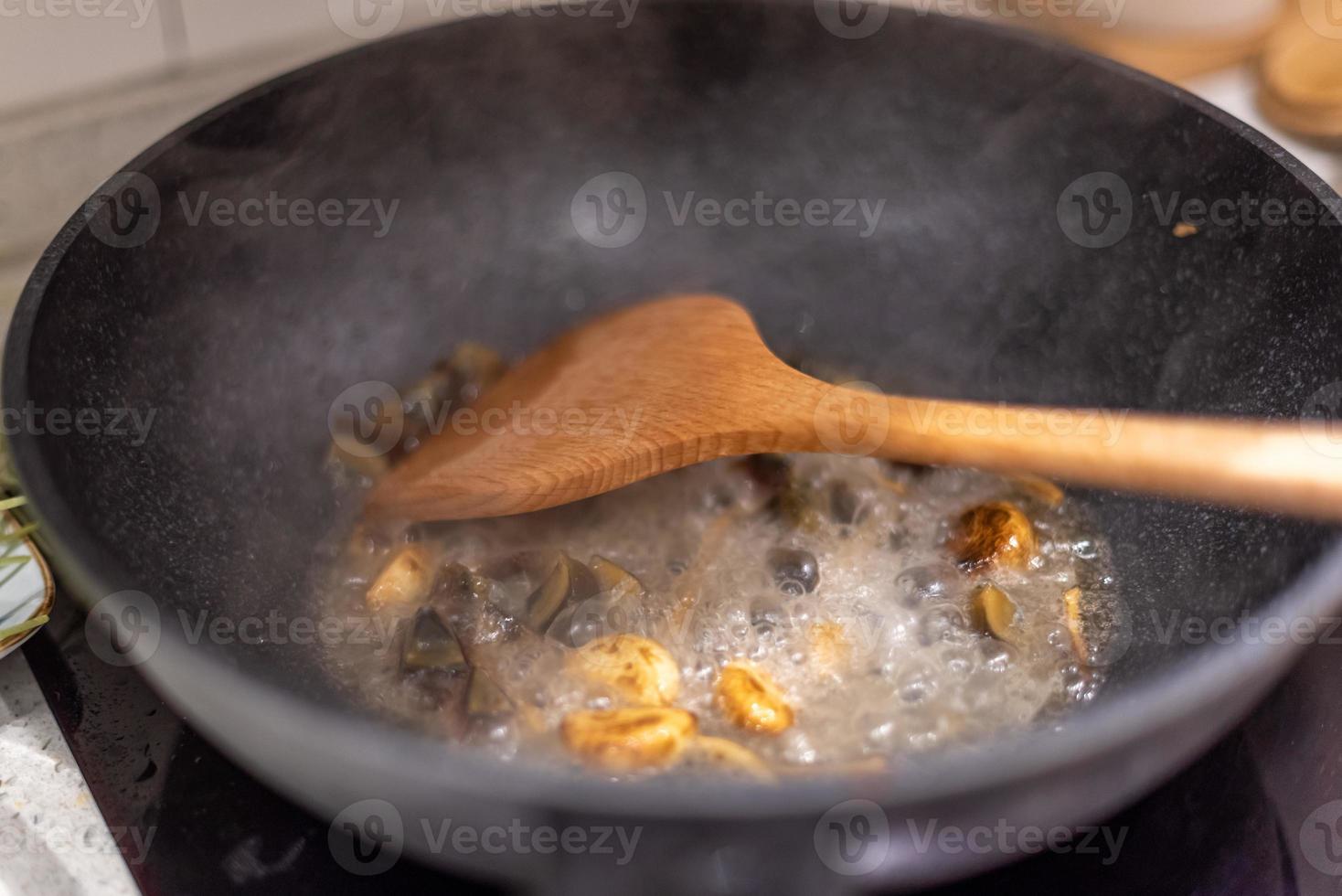 Washing vegetables, cutting meat, cooking for a dinner. photo