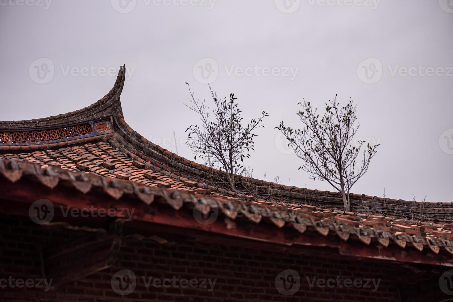 The eaves and corners of traditional Chinese residential buildings are made of red brick and lime photo