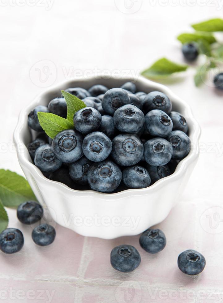 Blueberries on tile background photo