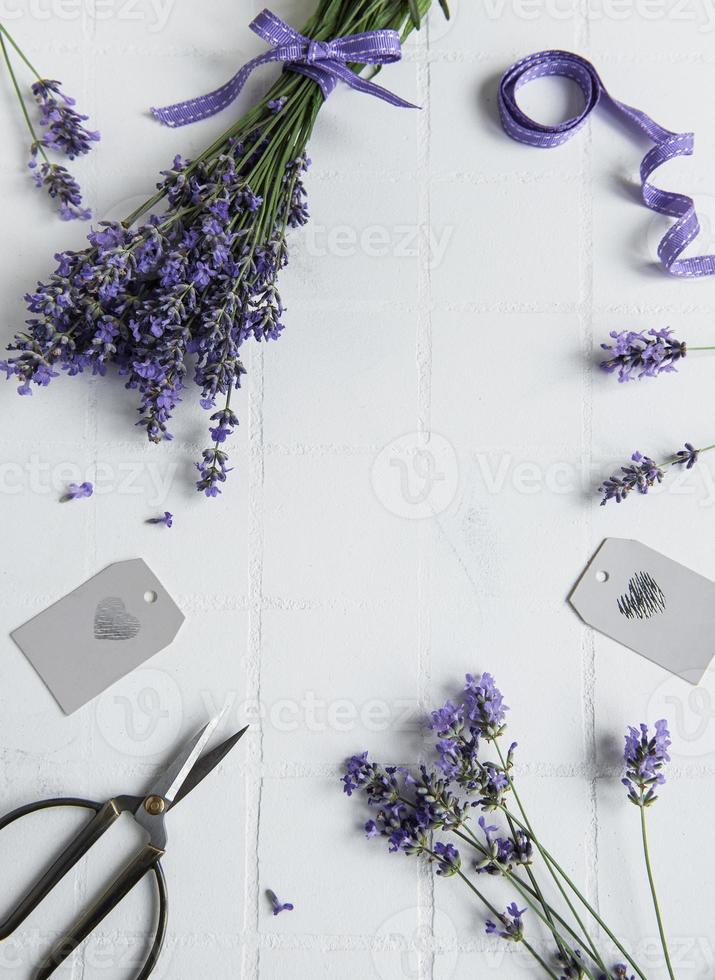 Lavender flowers, scissors and ribbon photo