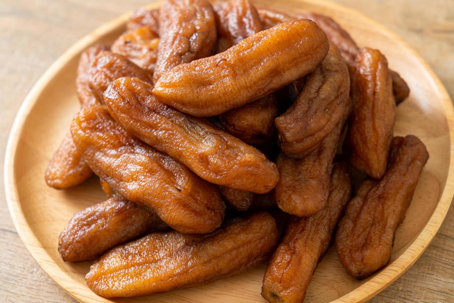 Sun dried banana on plate photo