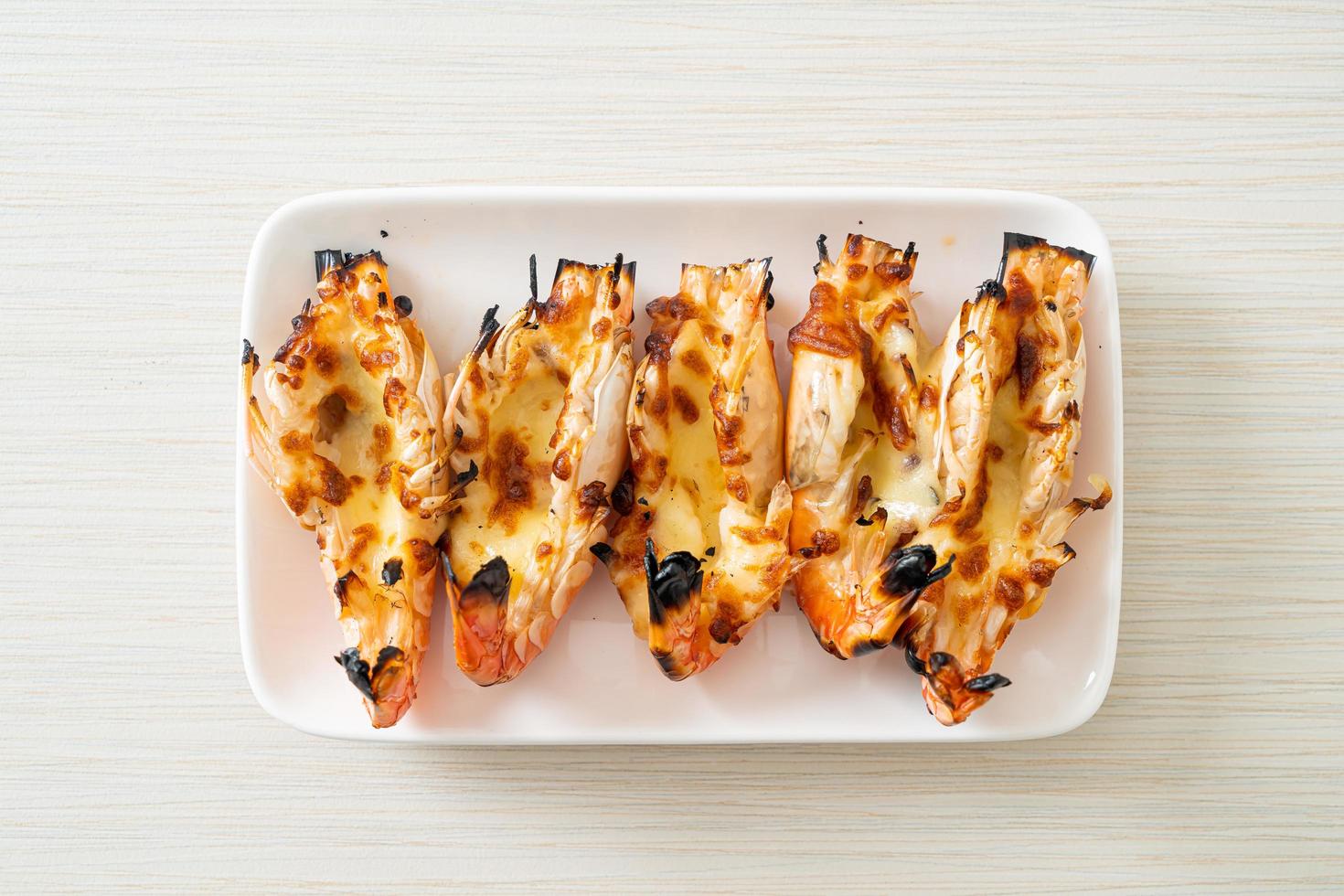 Grilled river prawns or shrimps with cheese photo