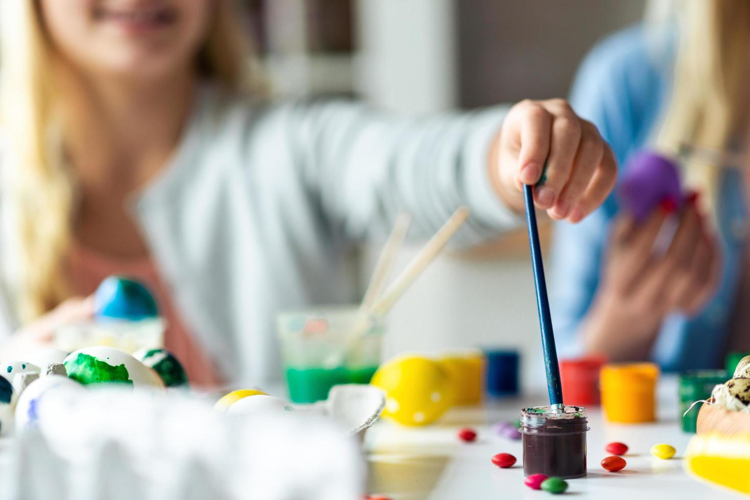 Easter egg coloring, paint and brush closeup. photo