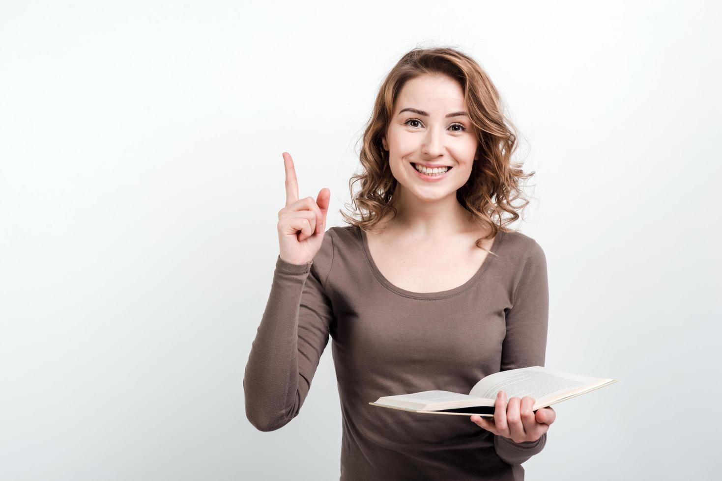 The girl with the book in her hands raised her thumb up, found a solution photo