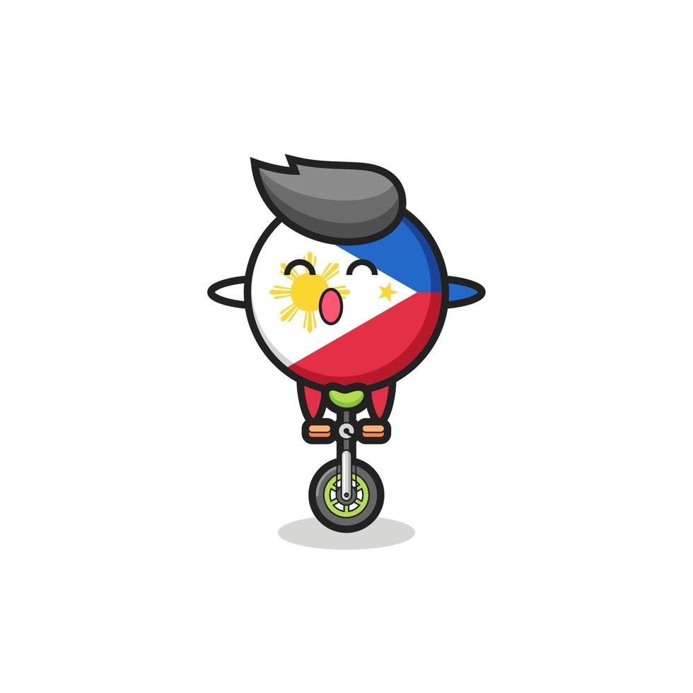 The cute philippines flag badge character is riding a circus bike vector