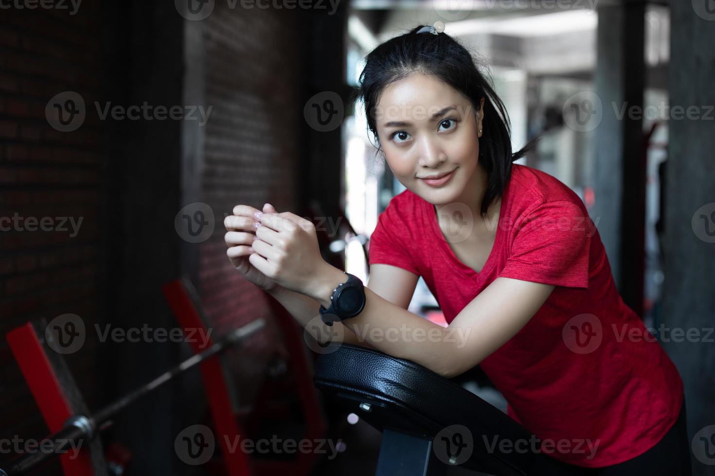 beautiful muscular fit woman exercising building muscles and fitness woman doing exercises in the gym. Fitness - concept of healthy lifestyle photo