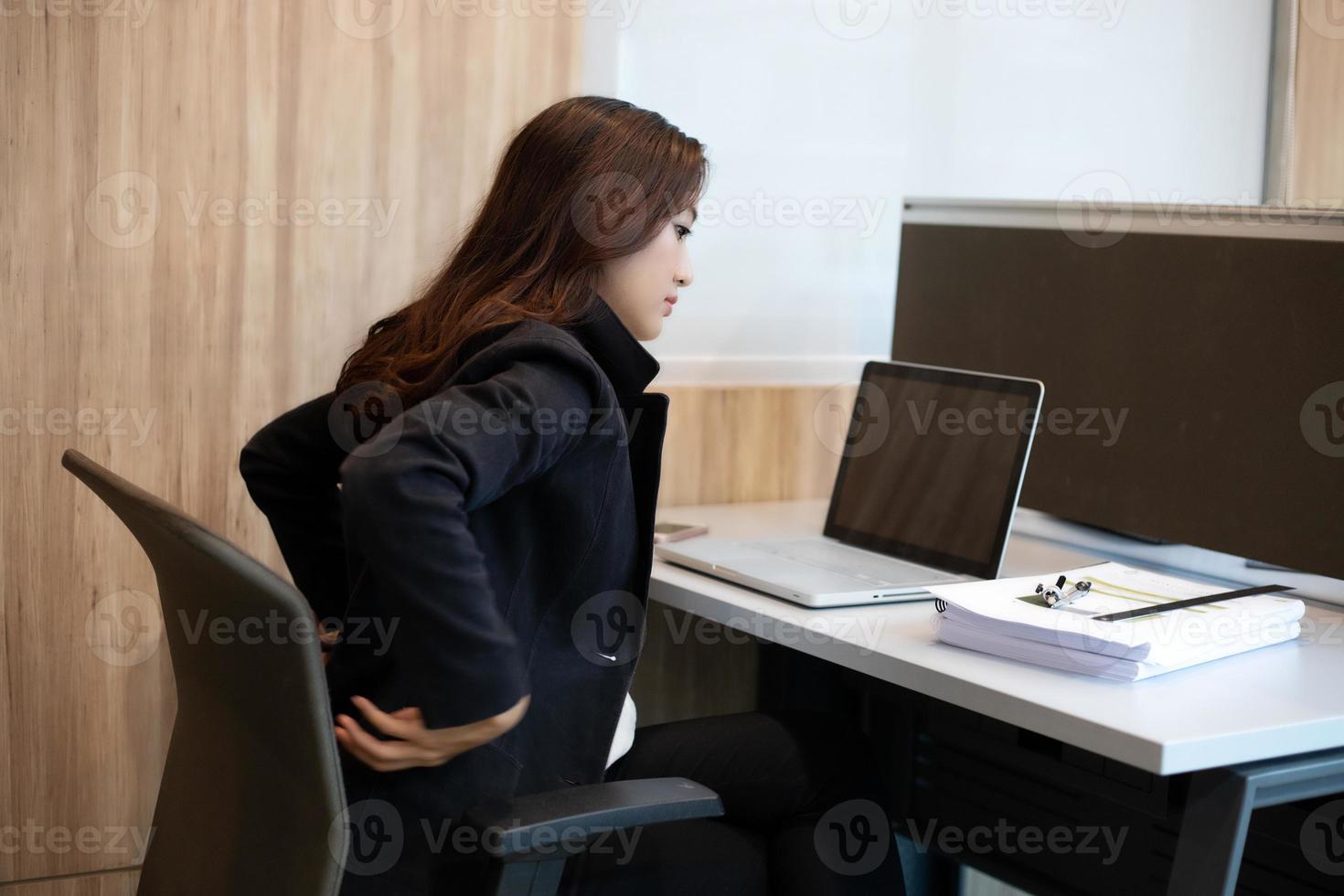 Asian Businessmen who work hard until they have back pain. photo