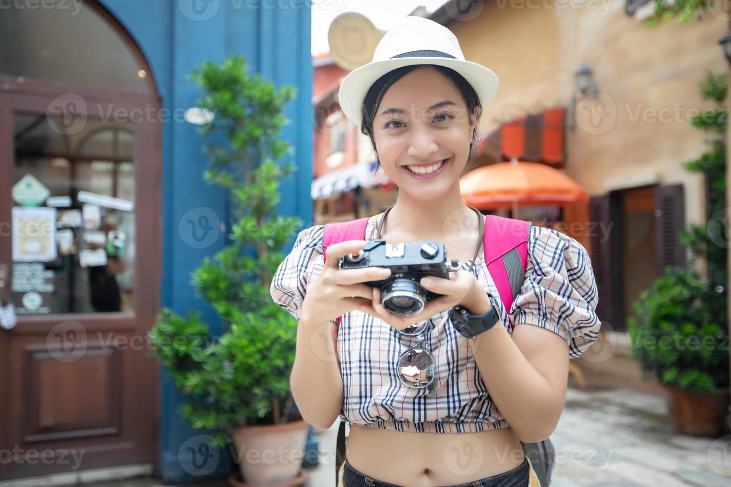 Asian women backpacks walking together and happy  are taking photo and selfie ,Relax time on holiday concept travel