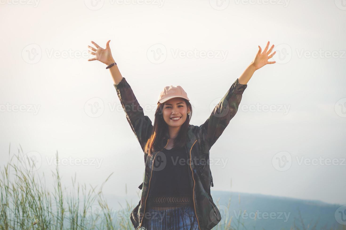 Asian  young women people Hiking with friends backpacks walking together and looking map and taking photo camera by the road and looking happy ,Relax time on holiday concept travel