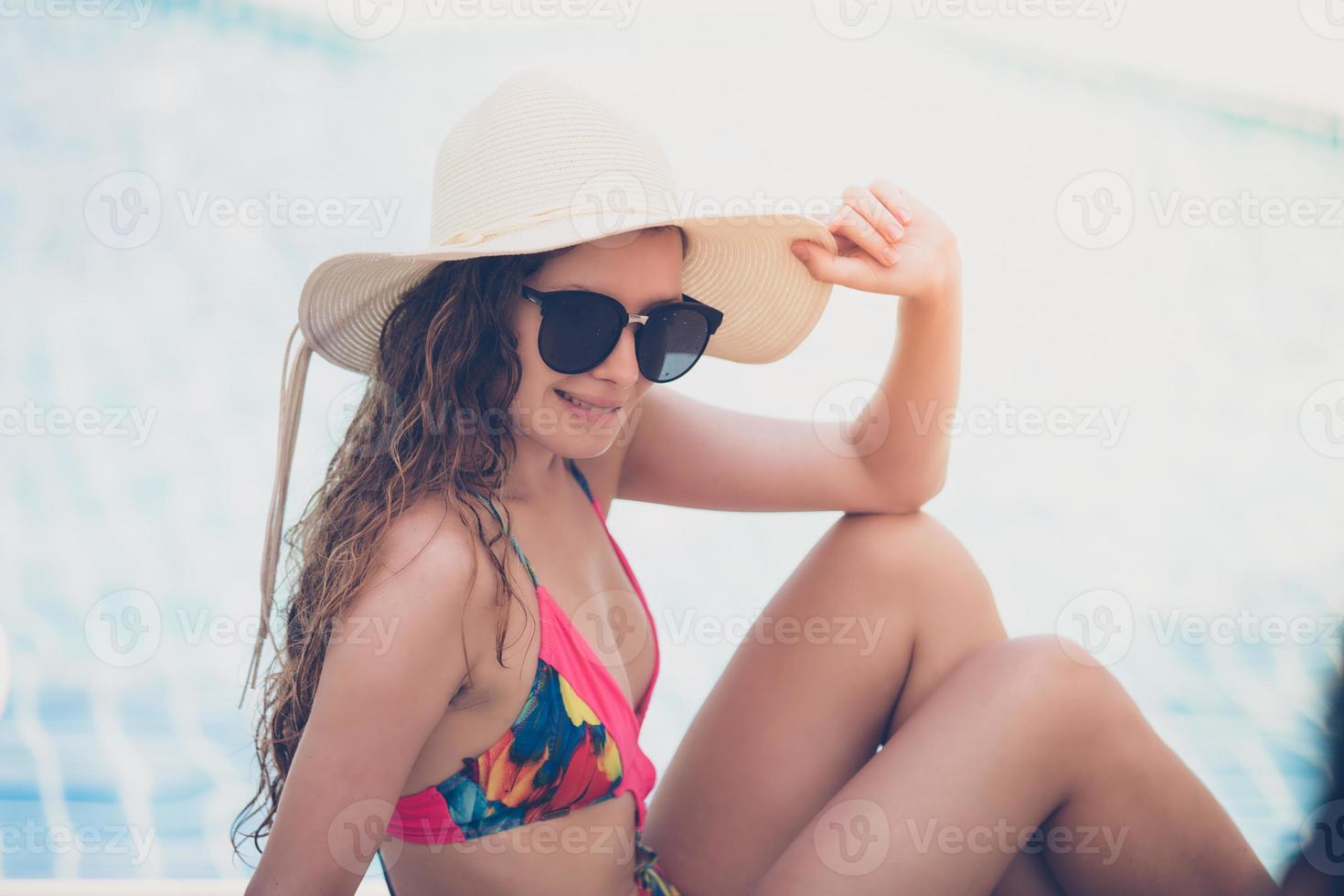 Women wear bikinis for swimming at the summer recreation pool photo