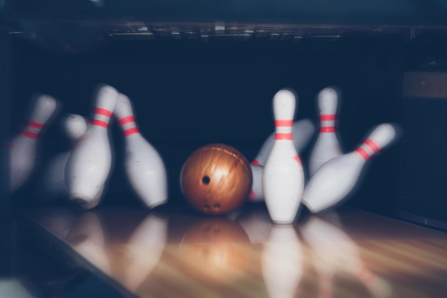 motion blur of bowling ball skittles on the playing field photo