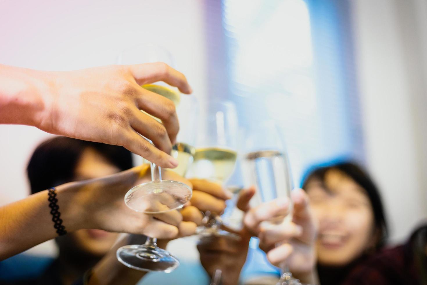 Asian group of friends having party with alcoholic beer drinks and Young people enjoying at a bar toasting cocktails.soft focus photo