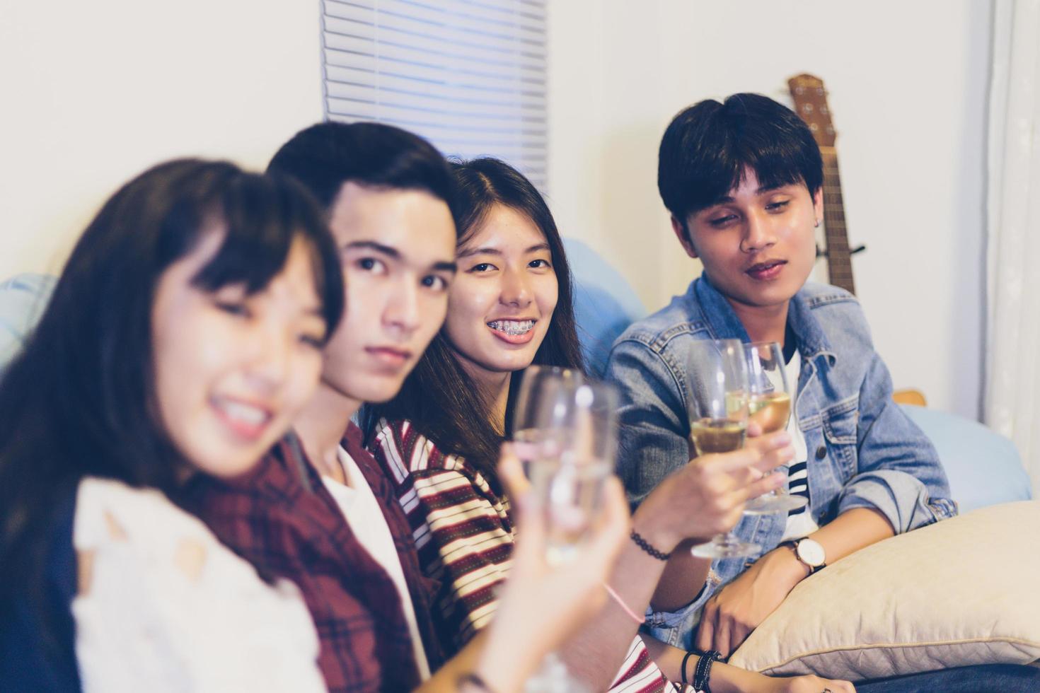 Asian group of friends having party with alcoholic beer drinks and Young people enjoying at a bar toasting cocktails.soft focus photo