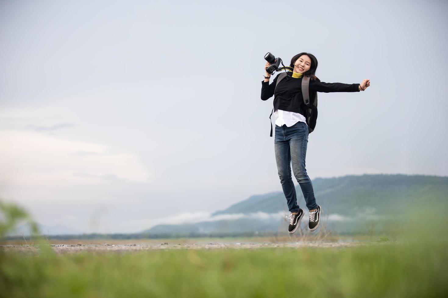 sian  young women people Hiking with friends backpacks walking together and looking map and taking photo camera by the road and looking happy ,Relax time on holiday concept travel