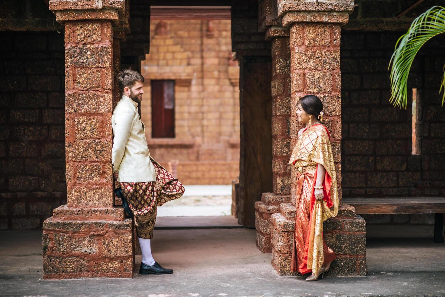 Asian bride and Caucasian groom have romantic time with Thailand dress photo