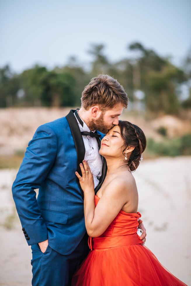 Asian bride and Caucasian groom have romance time and happy together photo