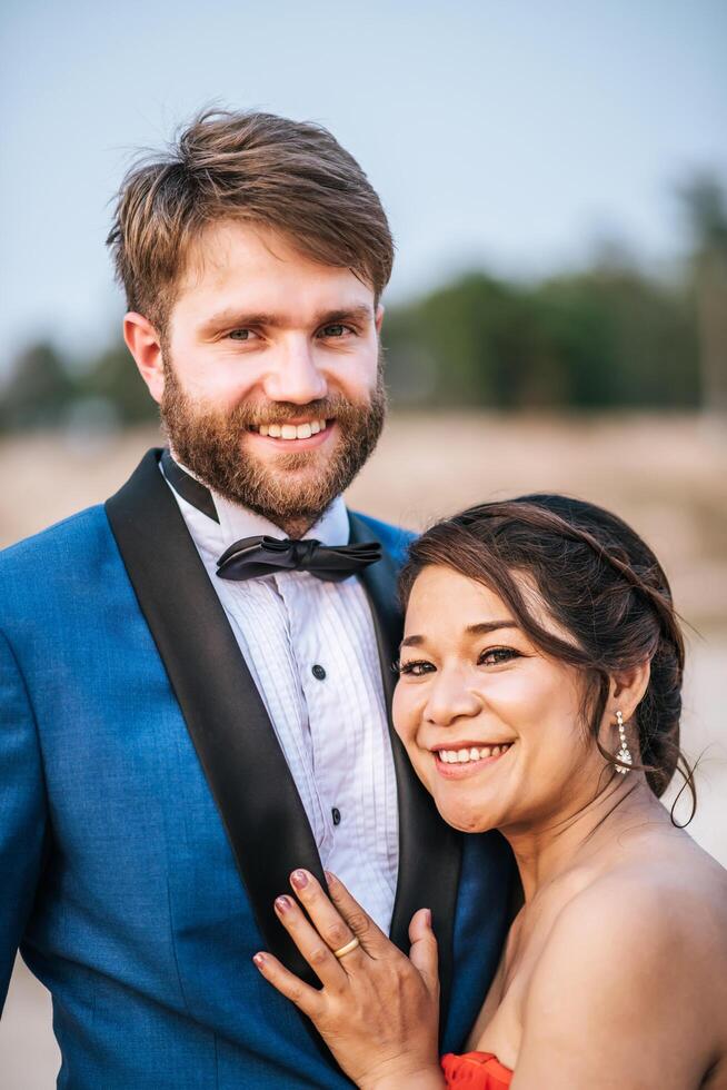 Asian bride and Caucasian groom have romance time and happy together photo