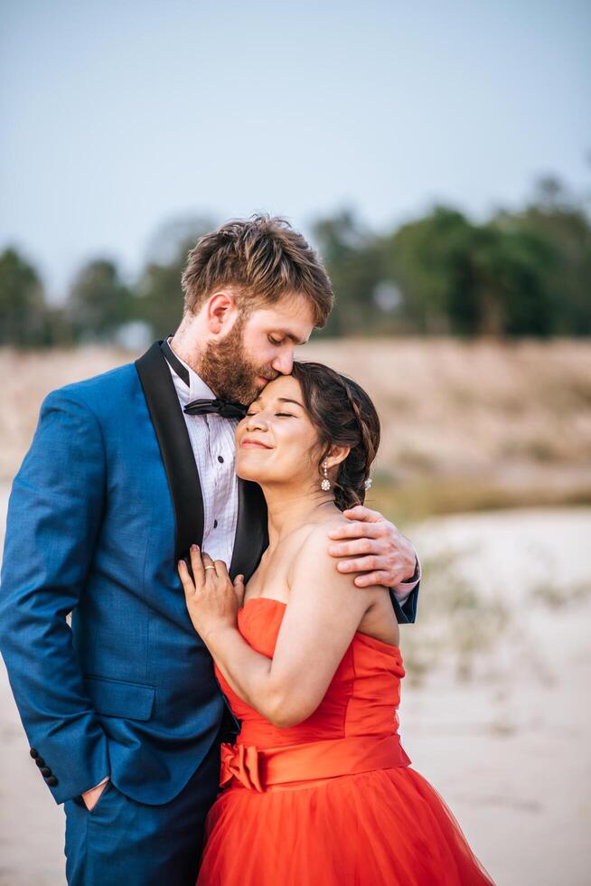 Asian bride and Caucasian groom have romance time and happy together photo