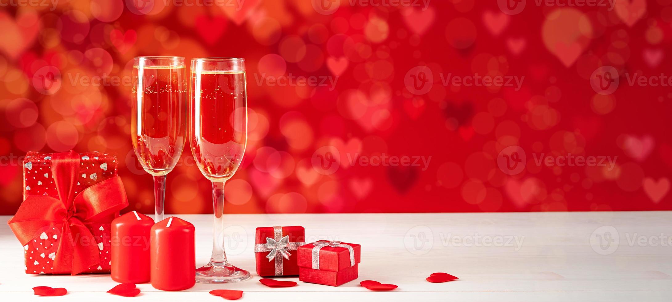 Two Champagne glasses on light bokeh background photo
