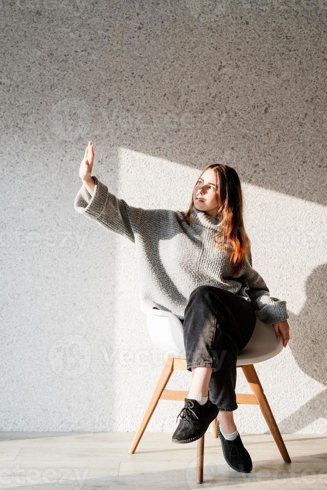 Portrait of a beautiful young woman with a shadow pattern on the face and body photo