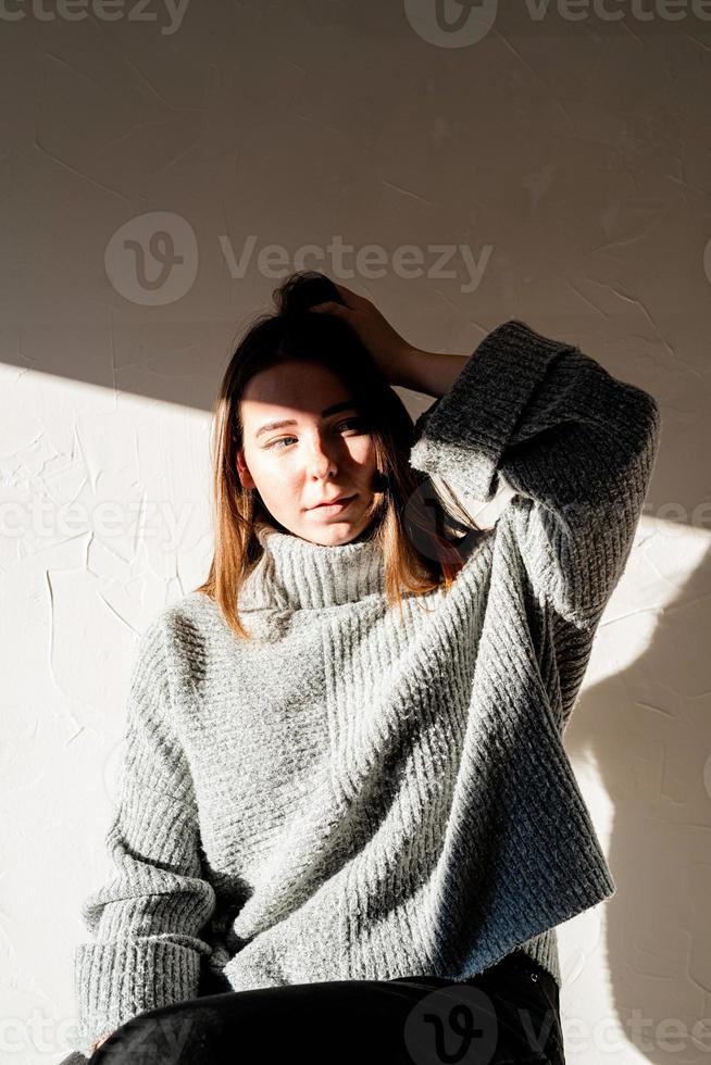 Portrait of a beautiful young woman with a shadow pattern on the face and body photo