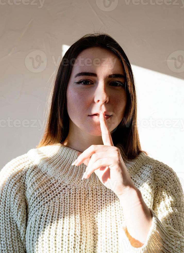 Portrait of a beautiful young woman with a shadow pattern on the face and body photo