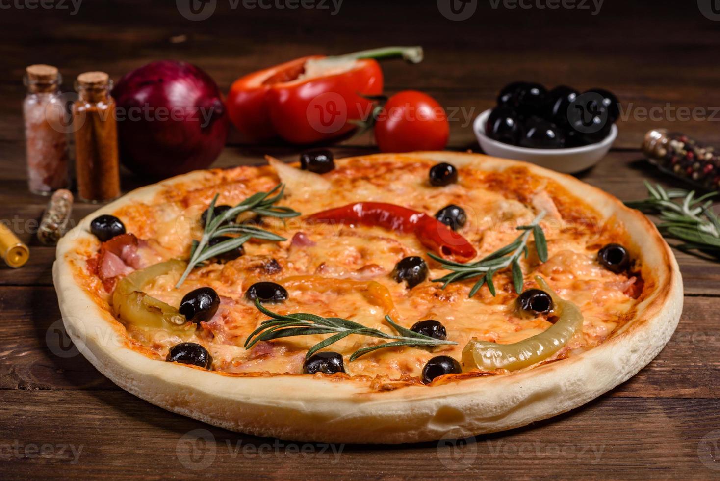 Tasty fresh hot pizza against a dark background. Pizza, food, vegetable, mushrooms photo