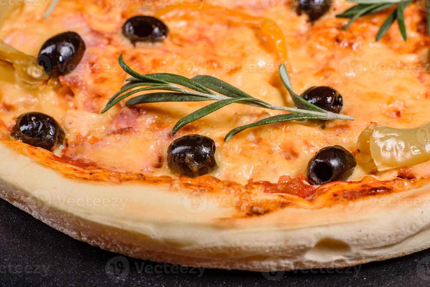 Tasty fresh hot pizza against a dark background. Pizza, food, vegetable, mushrooms photo