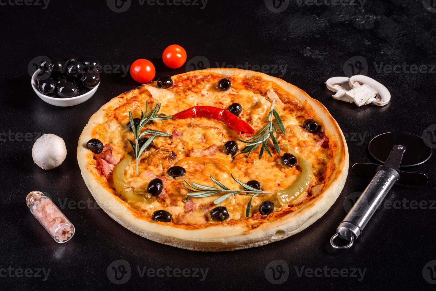 Tasty fresh hot pizza against a dark background. Pizza, food, vegetable, mushrooms photo