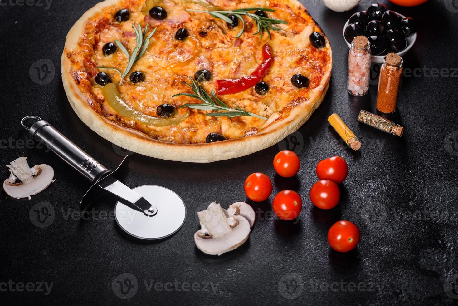 Tasty fresh hot pizza against a dark background. Pizza, food, vegetable, mushrooms photo