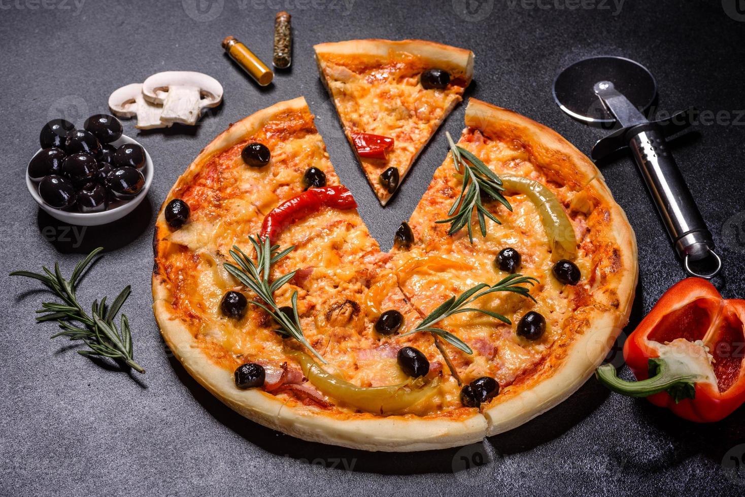 Tasty fresh hot pizza against a dark background. Pizza, food, vegetable, mushrooms photo