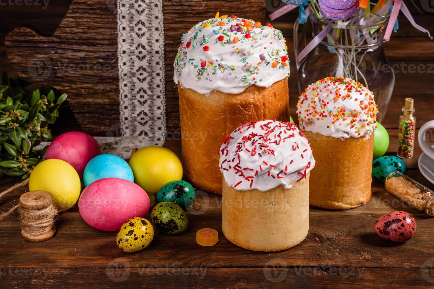 Easter cake and colorful eggs on a dark background photo