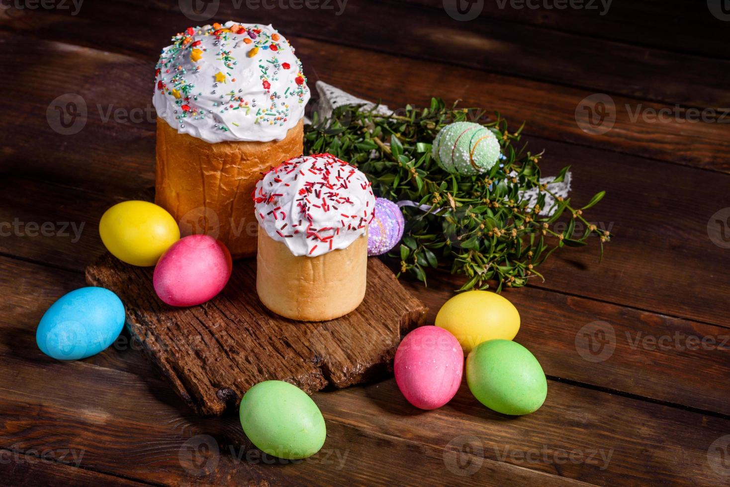 Easter cake and colorful eggs on a dark background photo