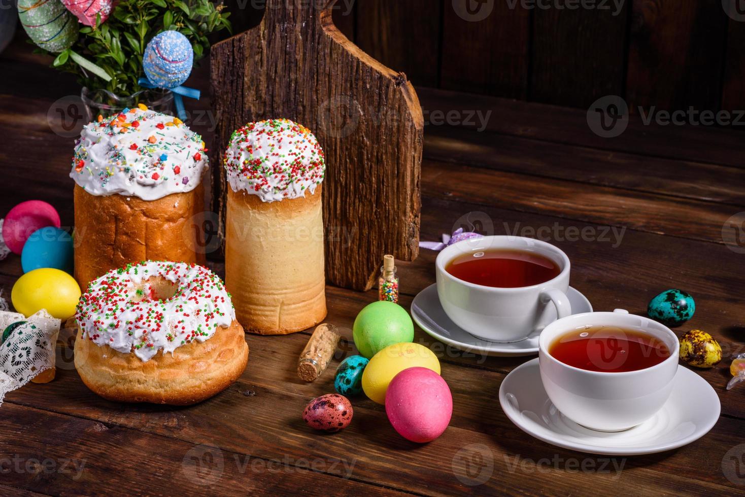 Easter cake and colorful eggs on a dark background photo