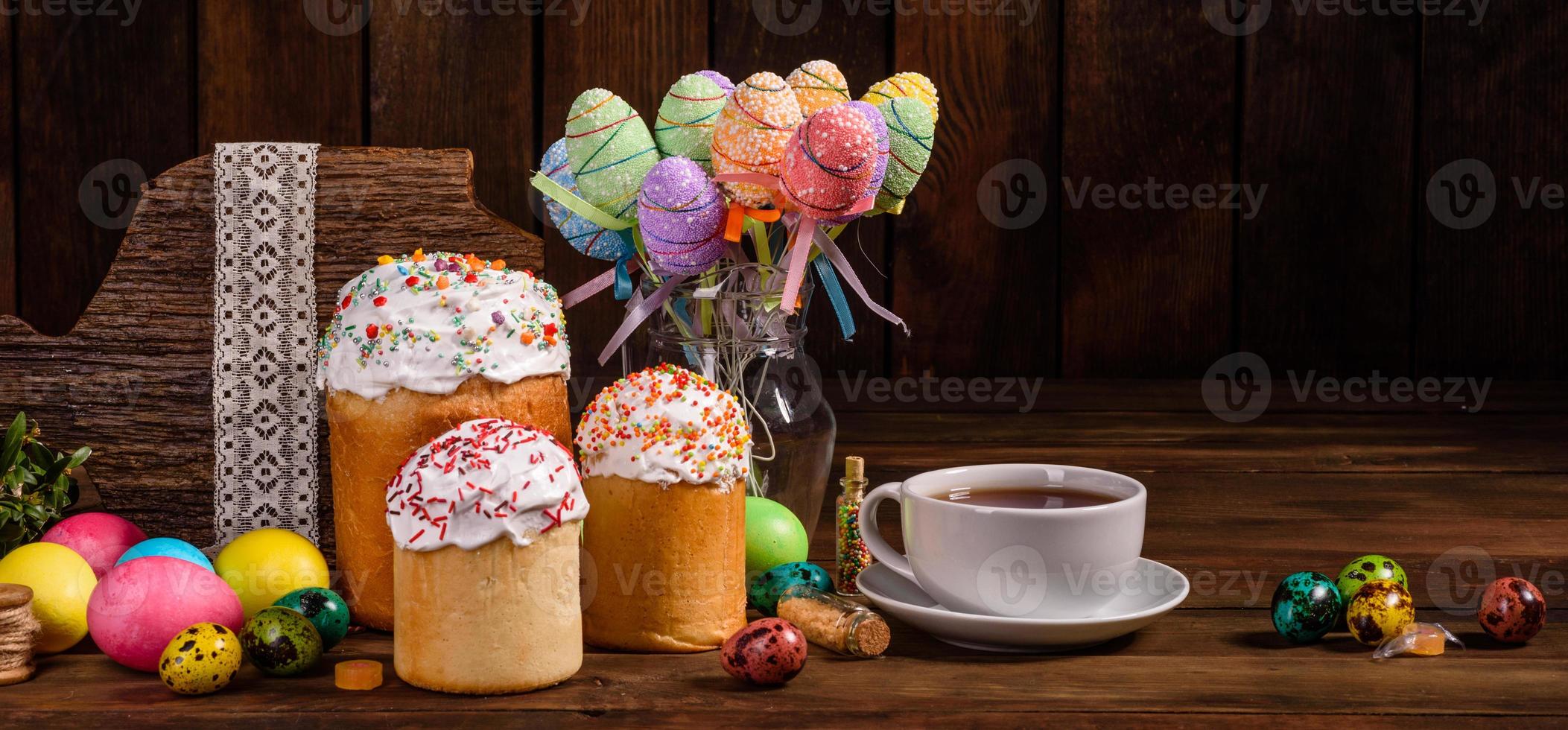 Easter cake and colorful eggs on a dark background photo