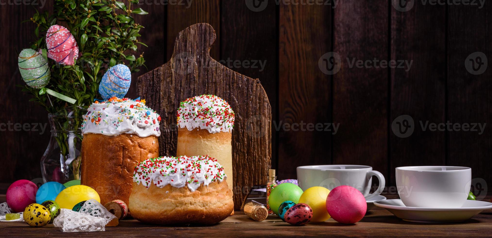 Easter cake and colorful eggs on a dark background photo