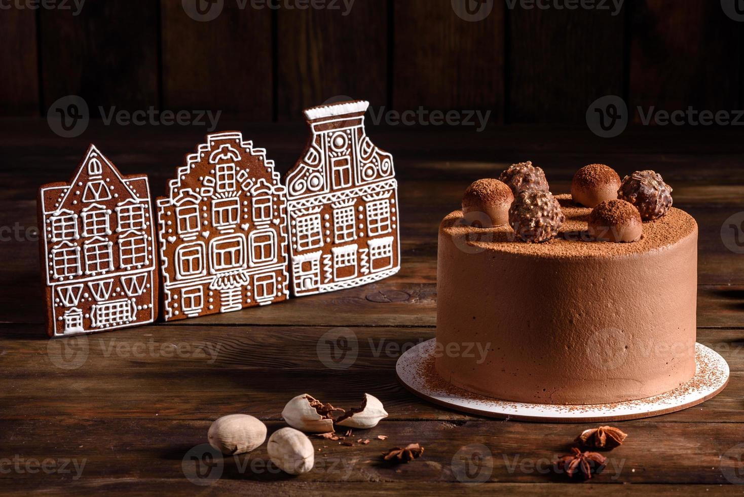 Delicious beautiful sweets on a dark wooden table on Christmas Eve photo