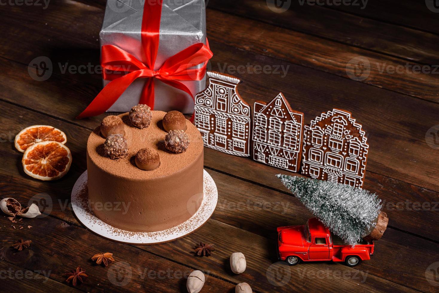 Delicious beautiful sweets on a dark wooden table on Christmas Eve photo