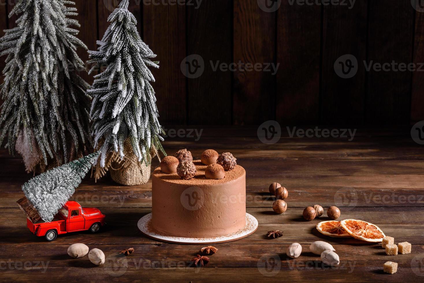 Delicious beautiful sweets on a dark wooden table on Christmas Eve photo