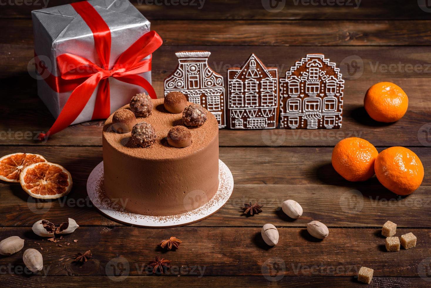 Delicious beautiful sweets on a dark wooden table on Christmas Eve photo