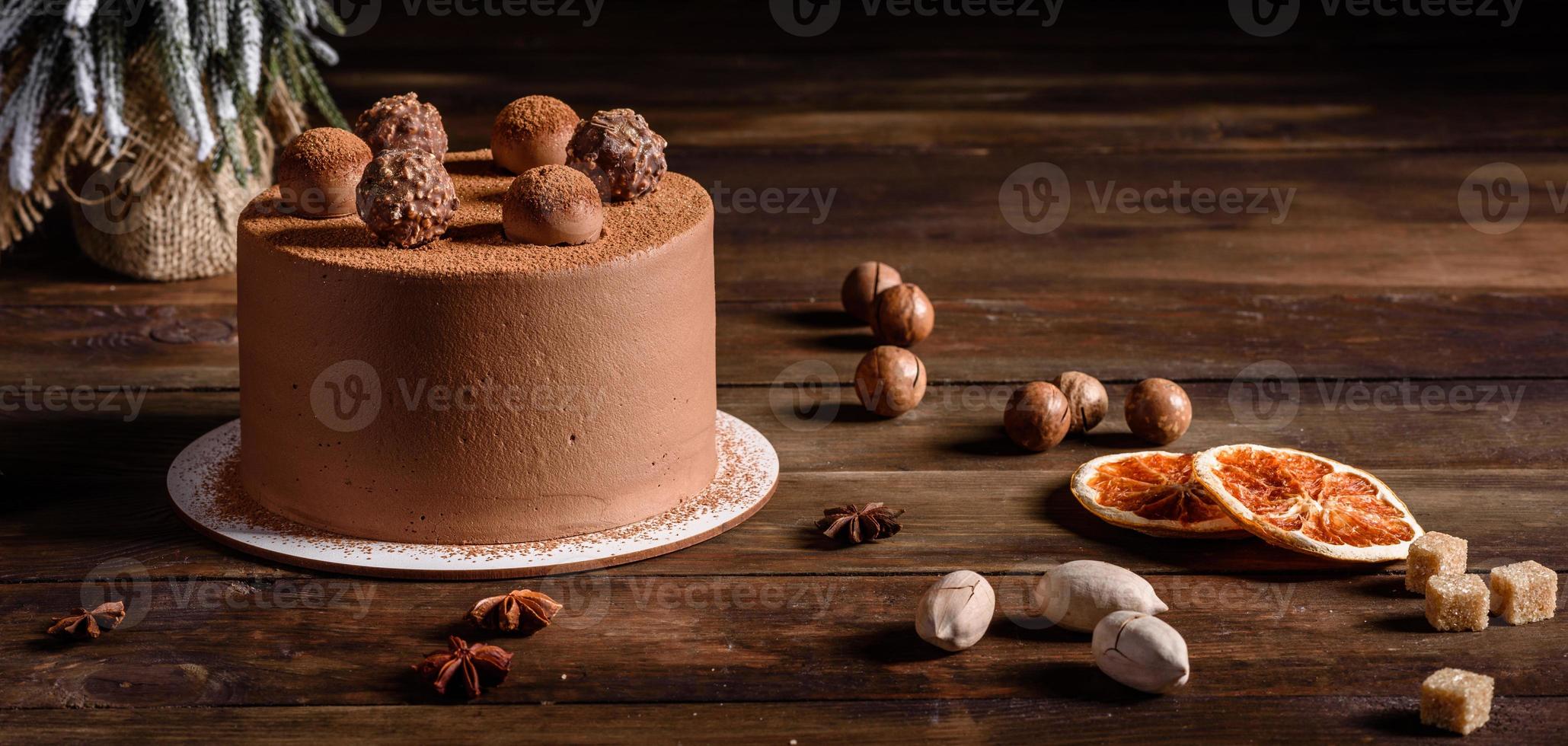 Delicious beautiful sweets on a dark wooden table on Christmas Eve photo