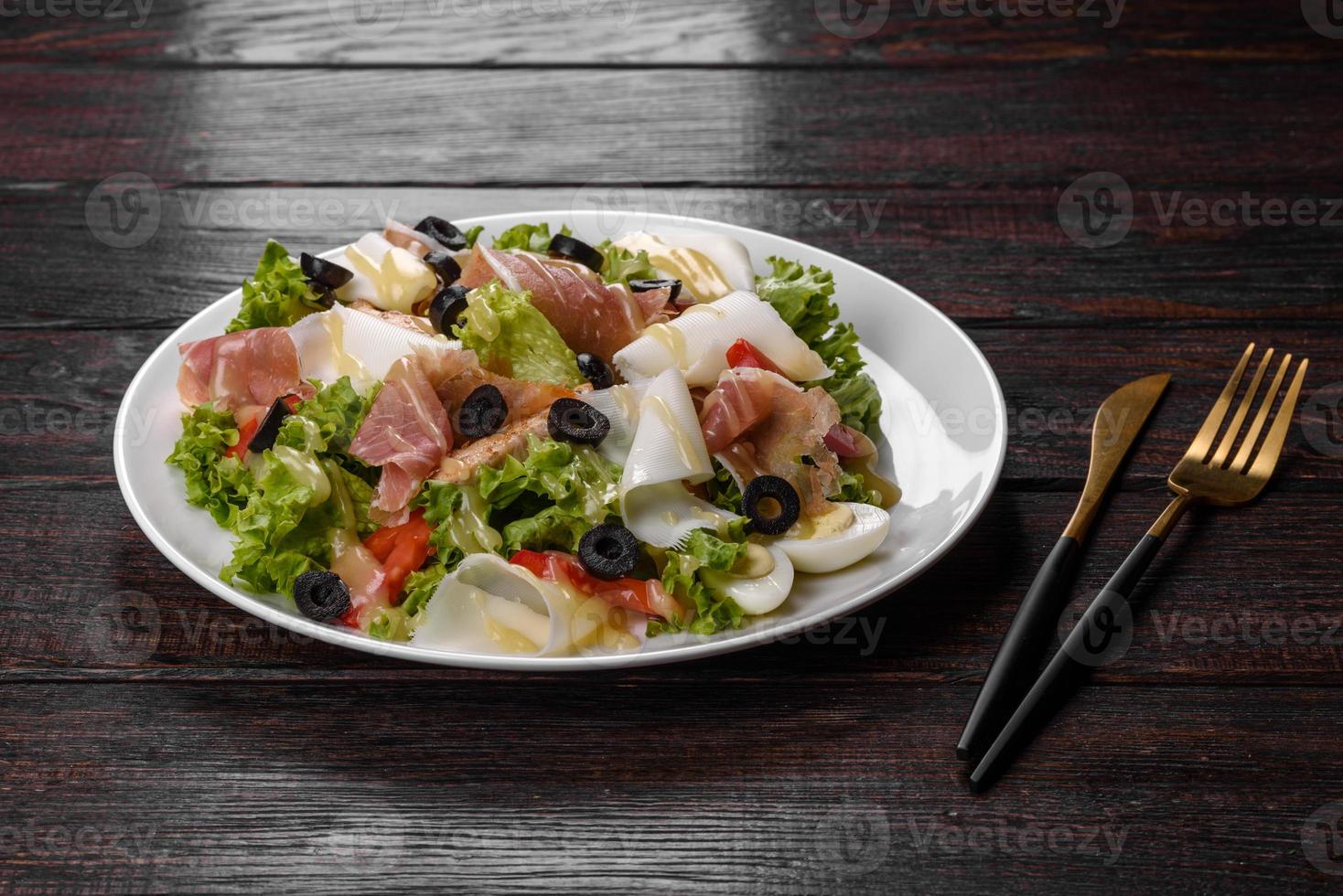 Delicious fresh salad with bacon for the festive table photo